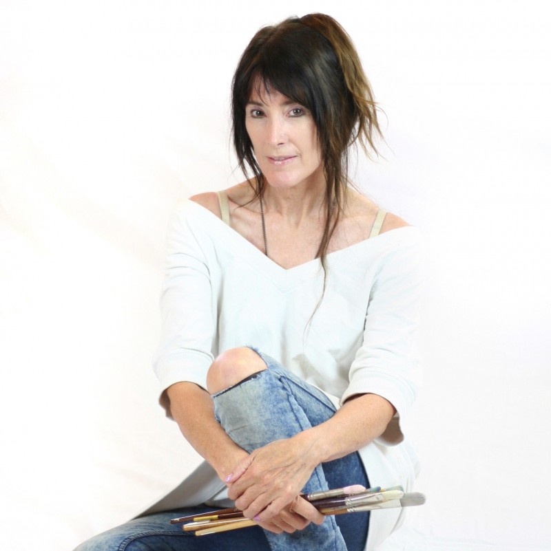 Artist Penny Cran Murphy with paintbrushes